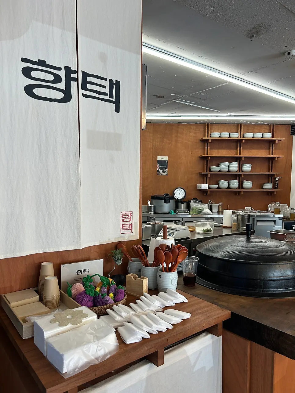 Tableware station beside the open kitchen