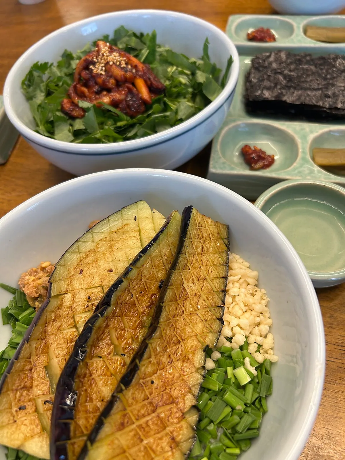 Eggplant doenjang rice and chamnamul squid rice meal spread