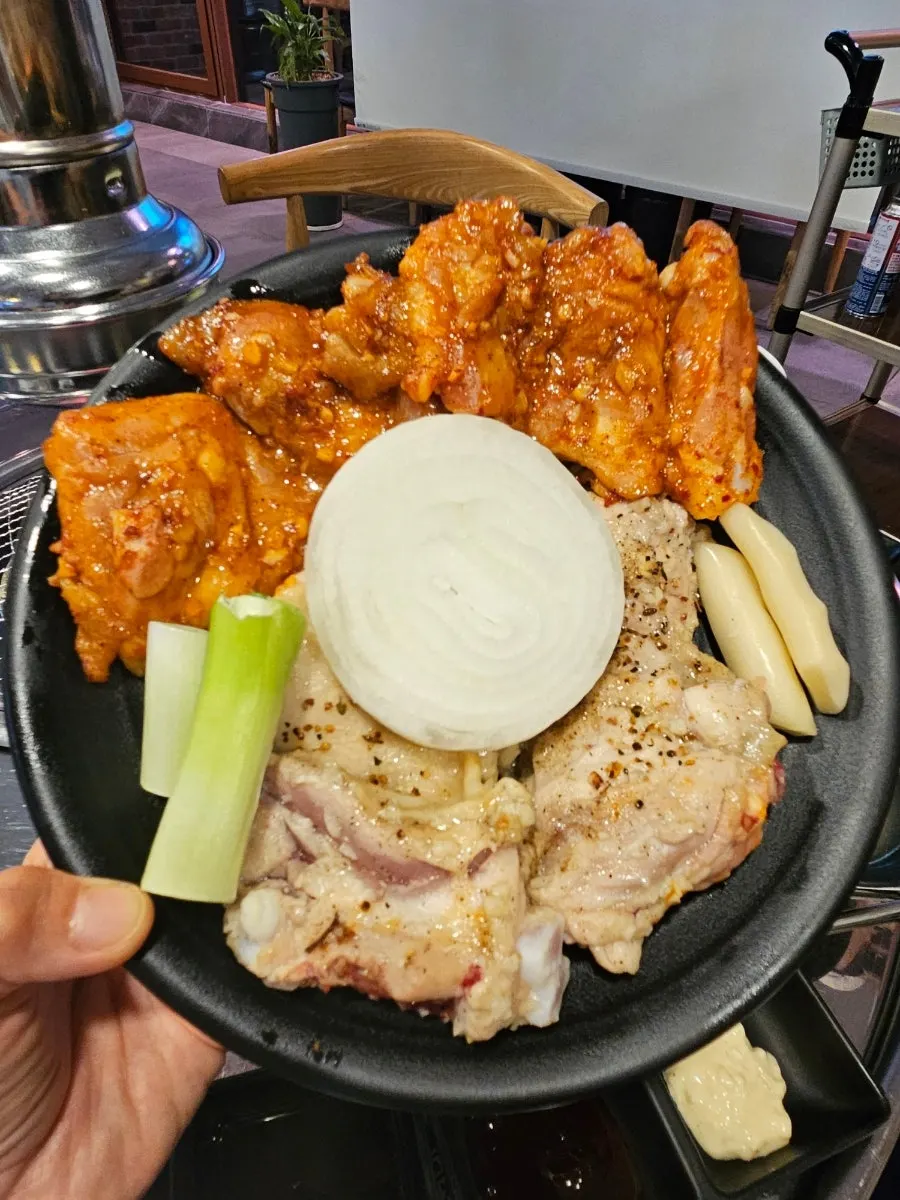 Plate of kimchi and namul side dishes from the self-bar