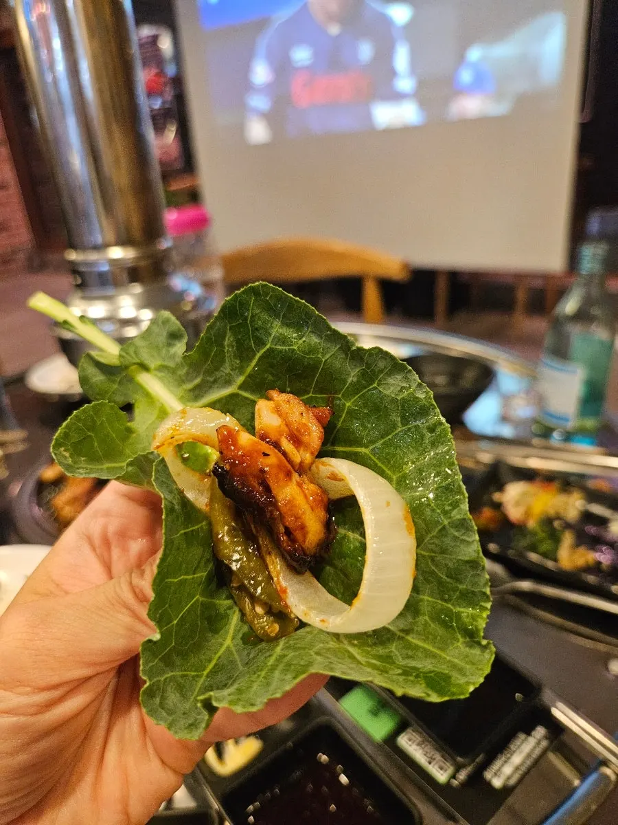 Two dipping sauces served with green onion kimchi and onion sauce
