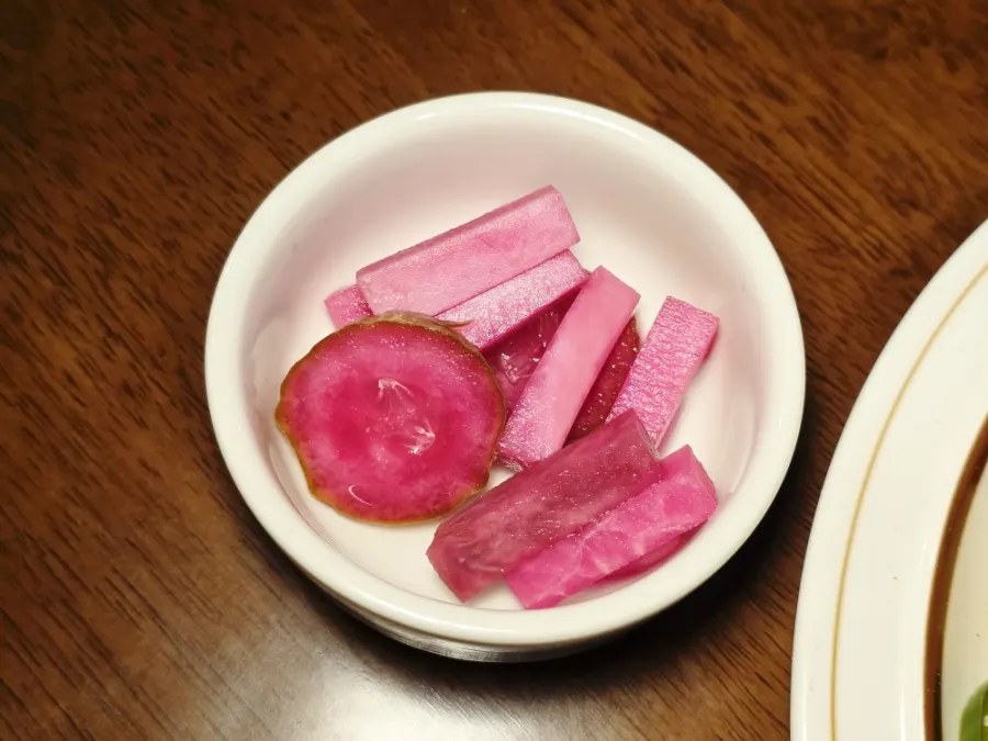 Freshly baked garlic baguette and beet cucumber pickles
