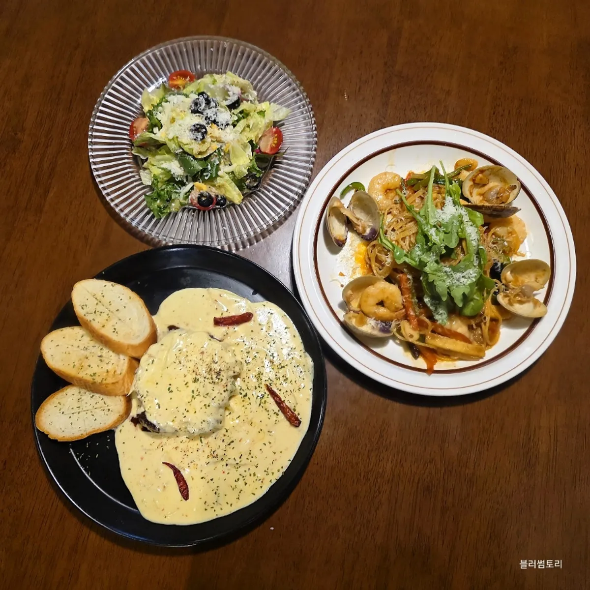 Steak and pasta laid out together on the table