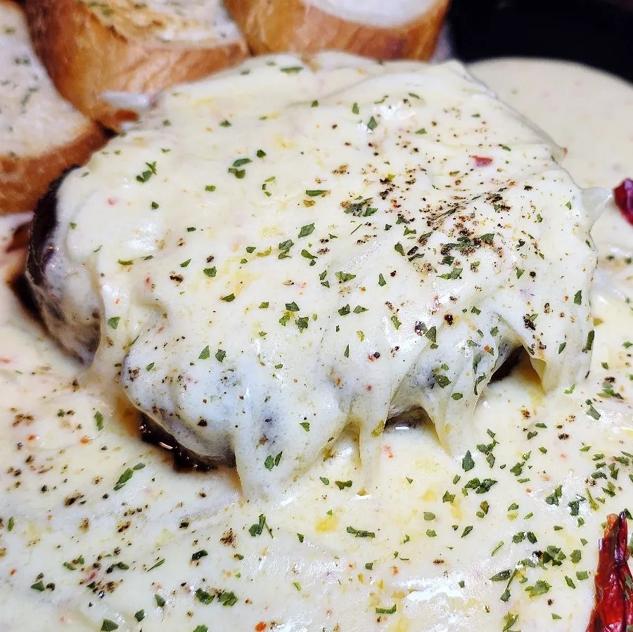 Tenderloin steak plated with cream sauce