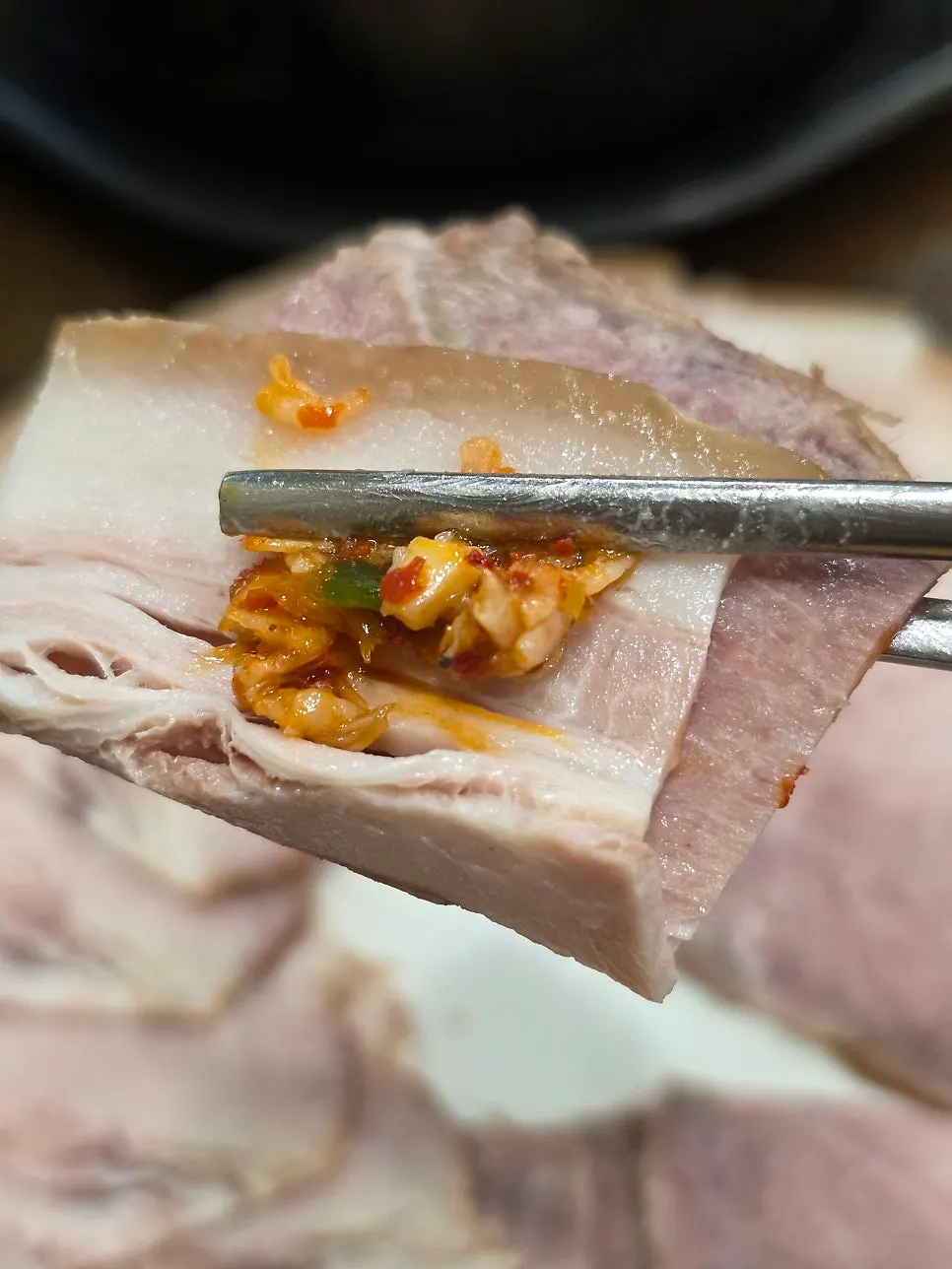 A spoonful of gukbap broth with rice