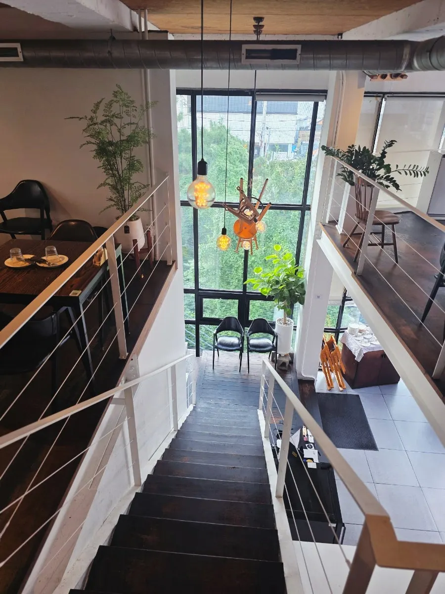 Stairs to the second floor in Dana’s split-level space