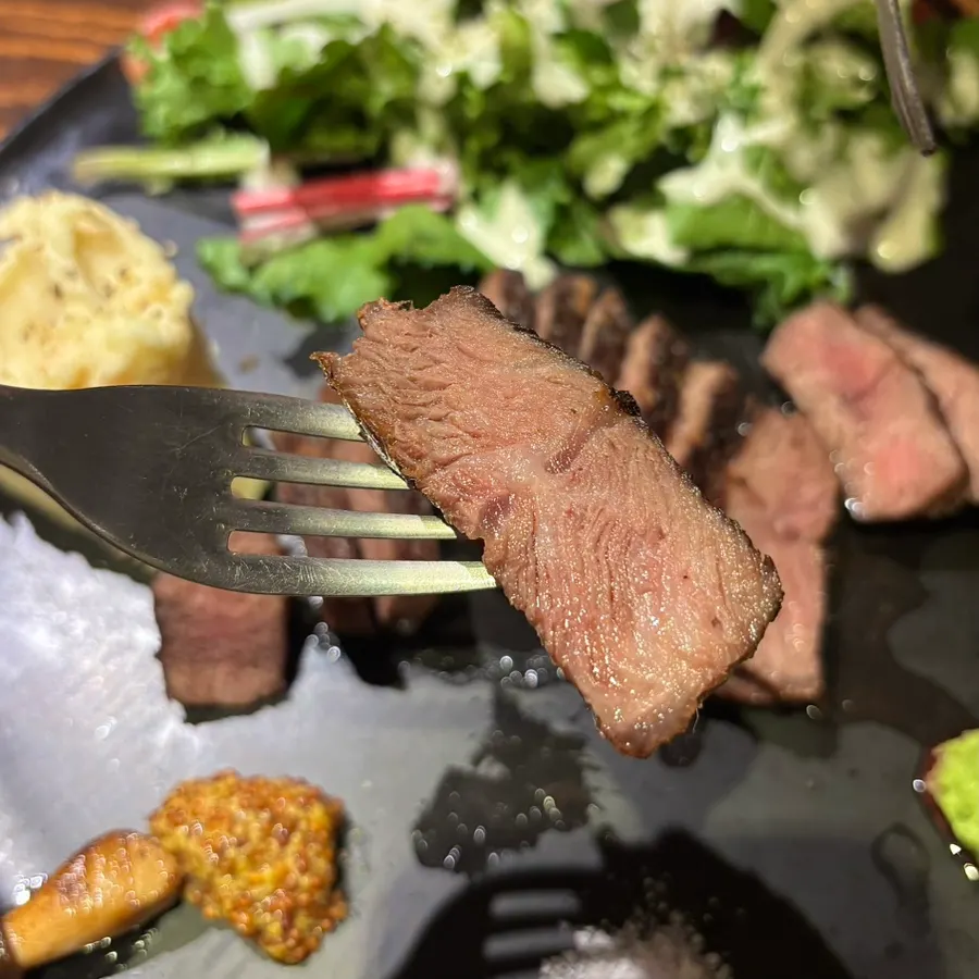 Steak with sauce and garnishes