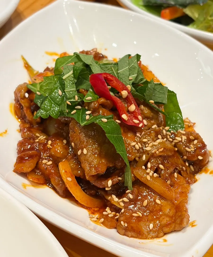 Charred grilled pork stir-fry with smoky flavor