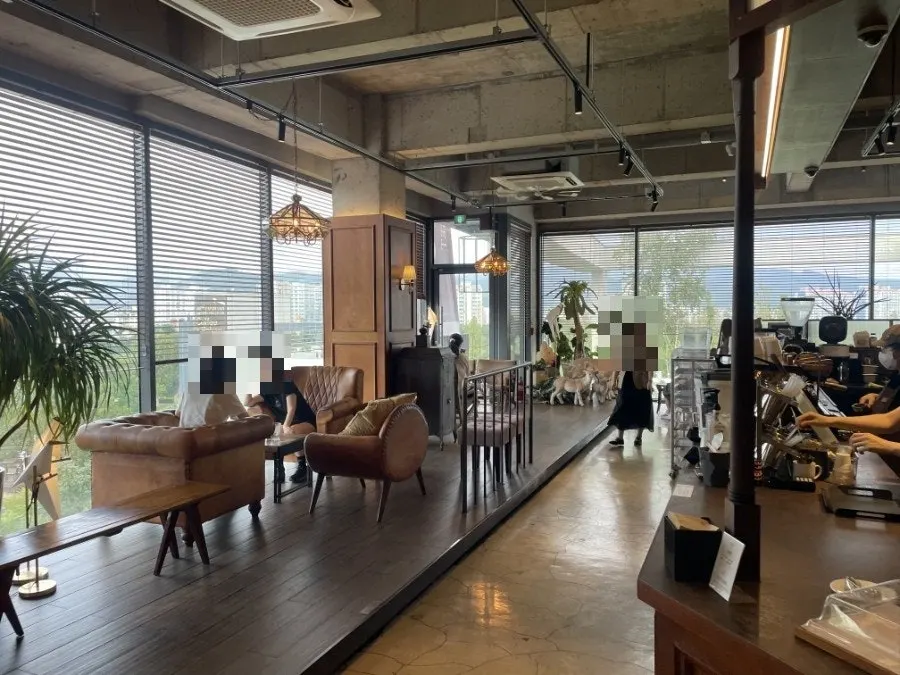 Wood-toned second-floor café interior