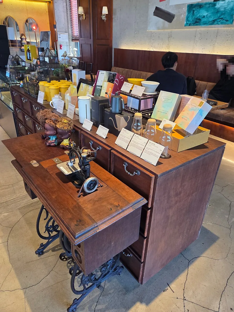 Coffee bean and merchandise display made from a sewing machine