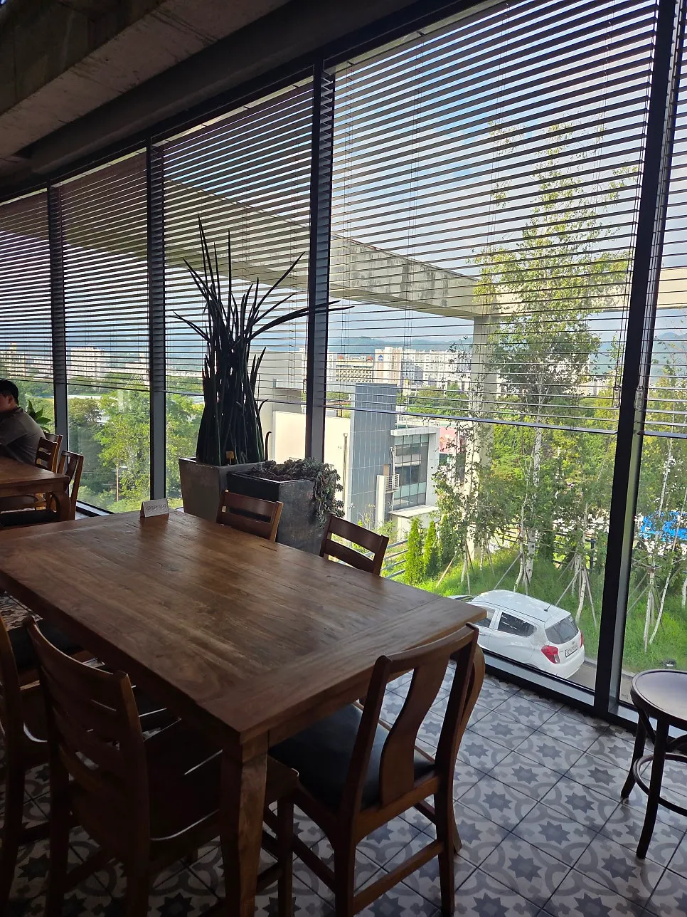 Café seating with large wooden tables for groups