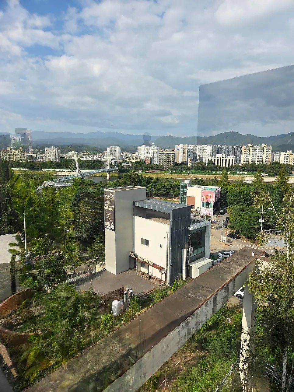 Rooftop view of mountain ridges and sky