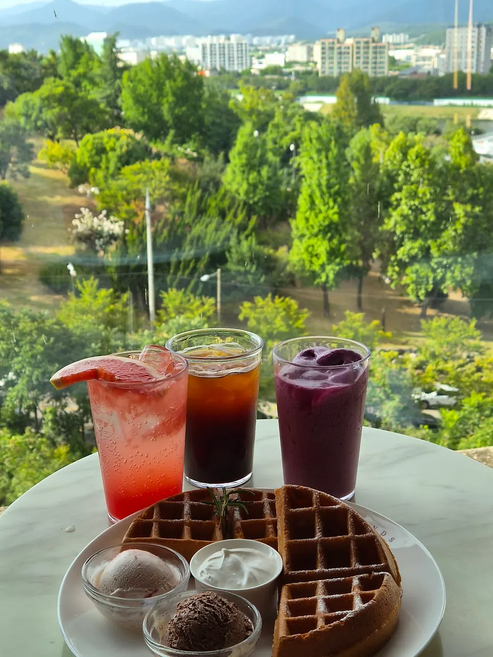 A full spread of ice cream waffles and drinks