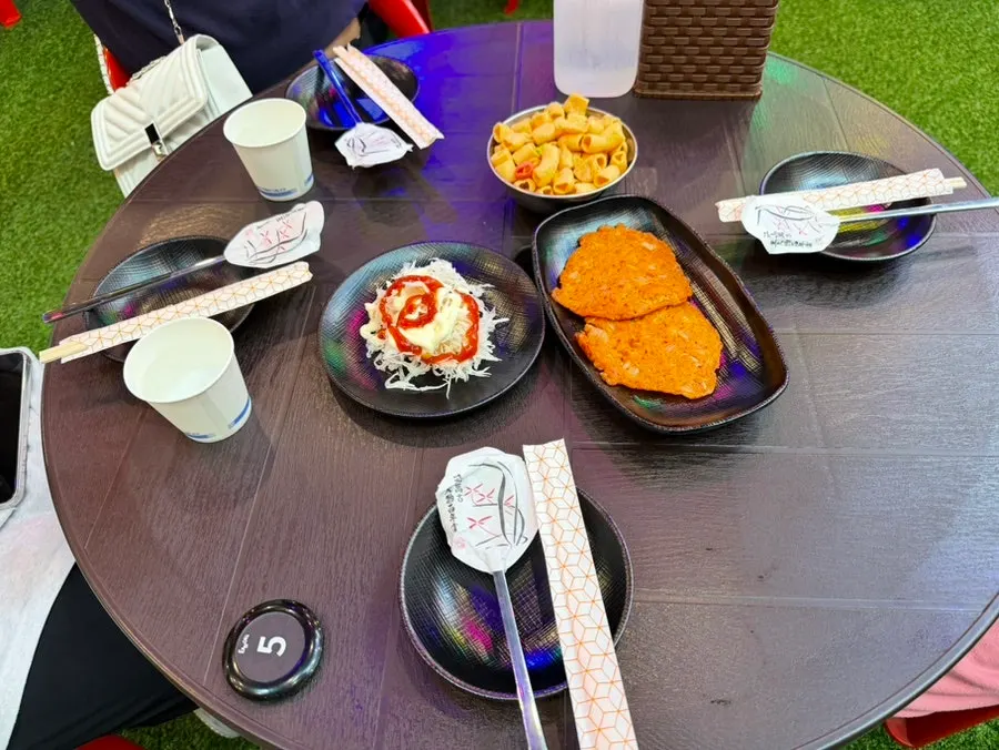 Kimchi pancake, salad, and snacks served as basic sides