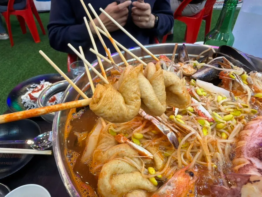 Seafood fish cake stew with whole squid and crab
