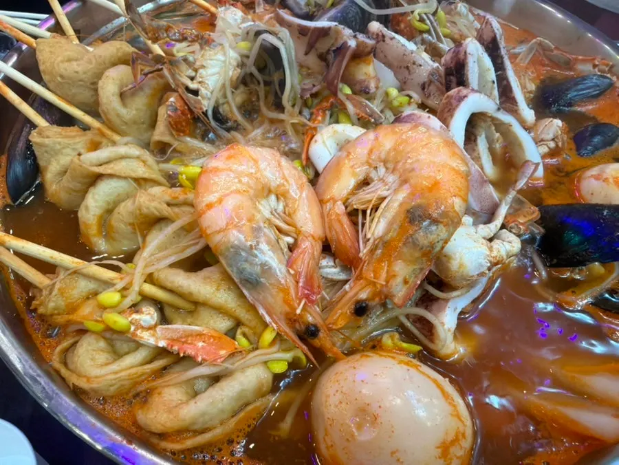 Whole squid and fish cake in the broth