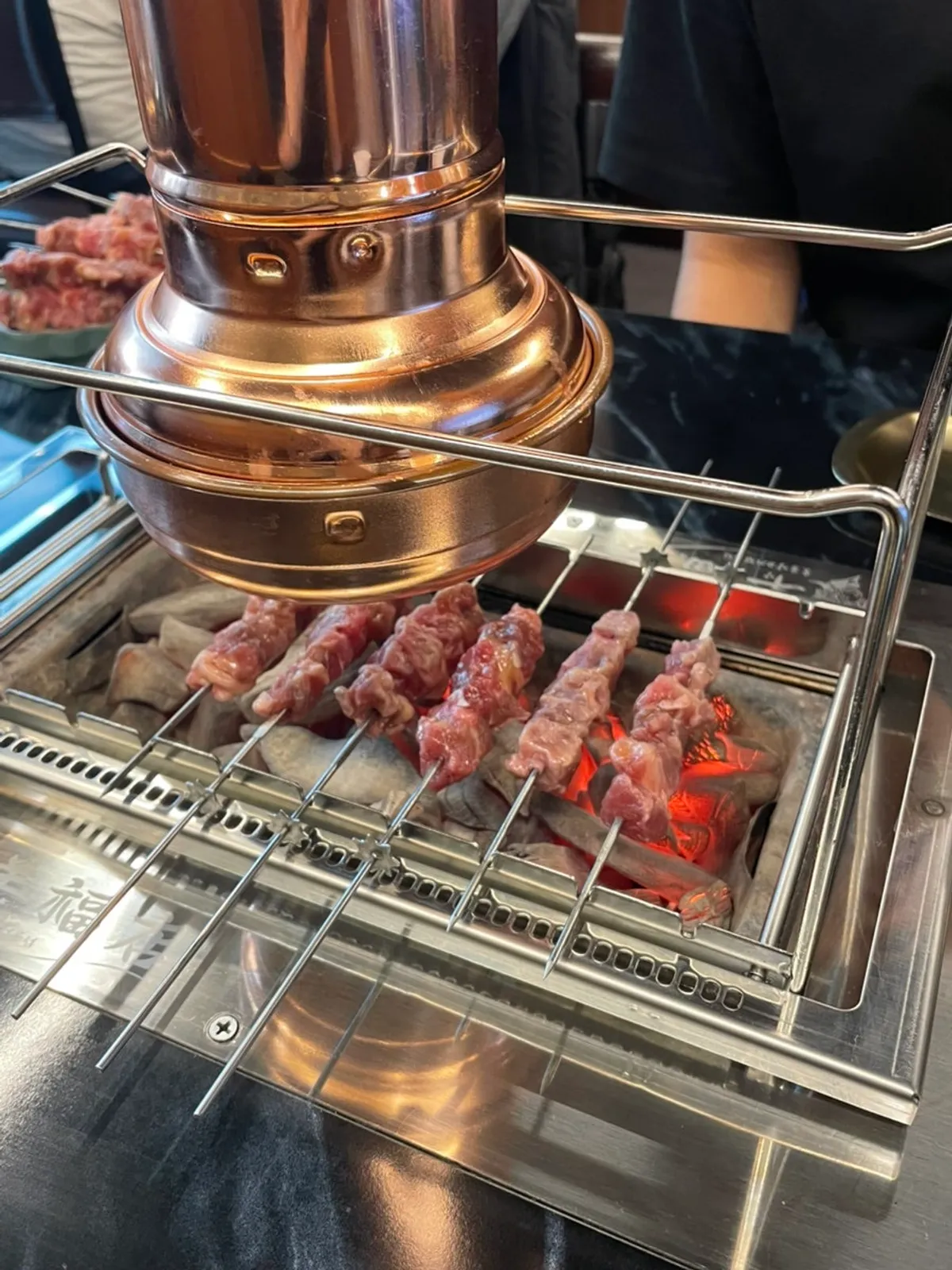 Lamb skewers on the automatic rotating grill