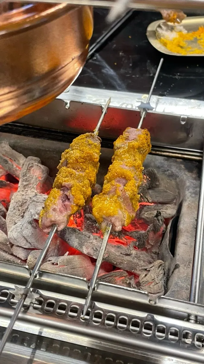 Lamb skewers grilled with curry powder sprinkled over them