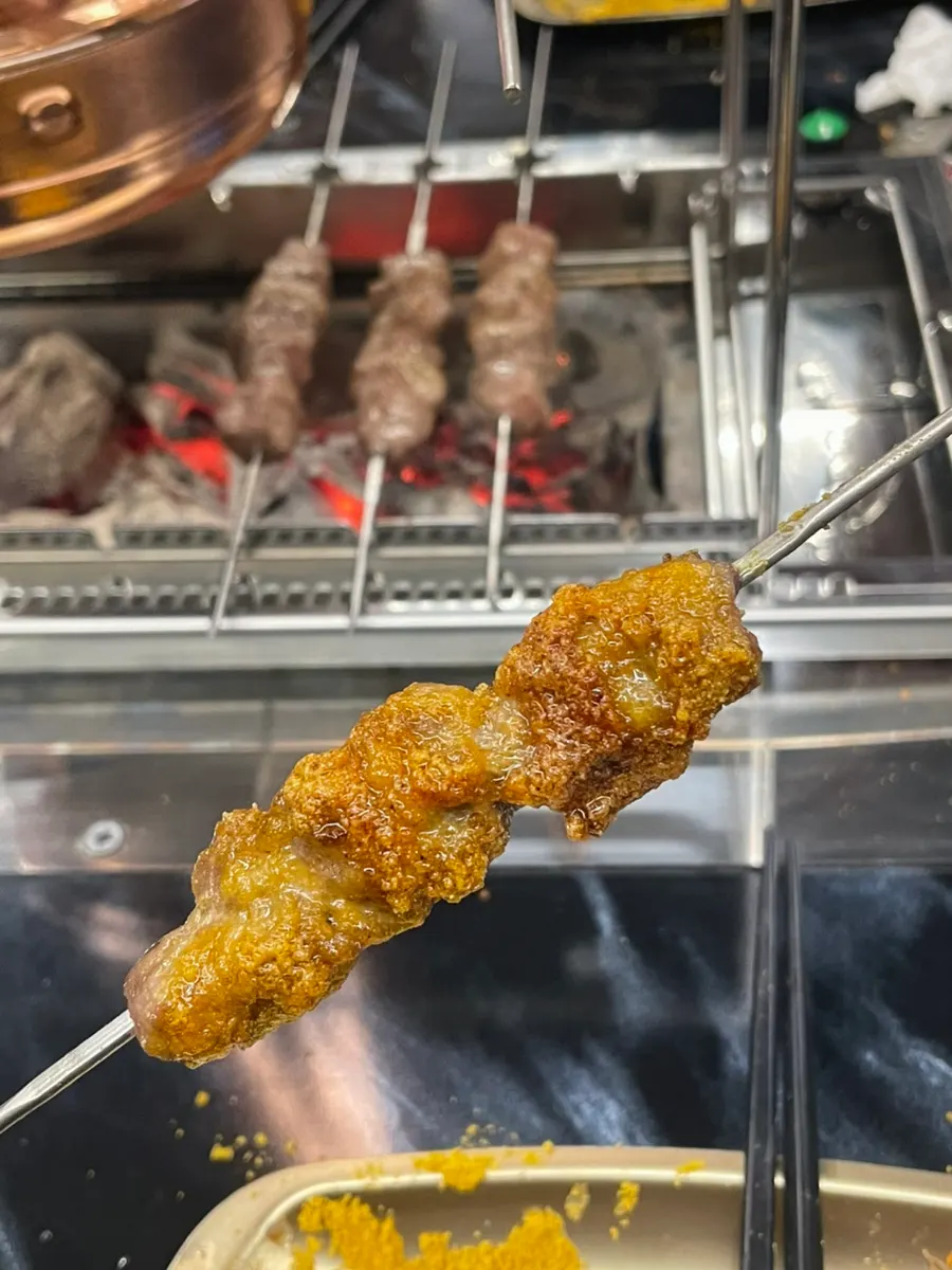 Lamb skewers seasoned with curry powder