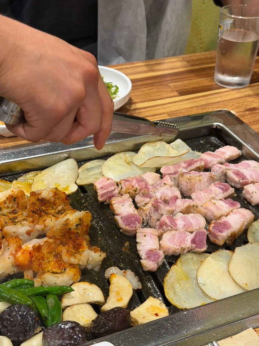Meat grilled by a staff member