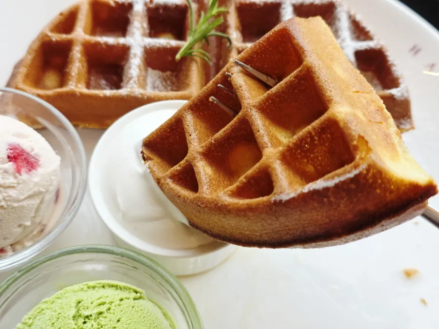 Freshly baked waffle and whipped cream