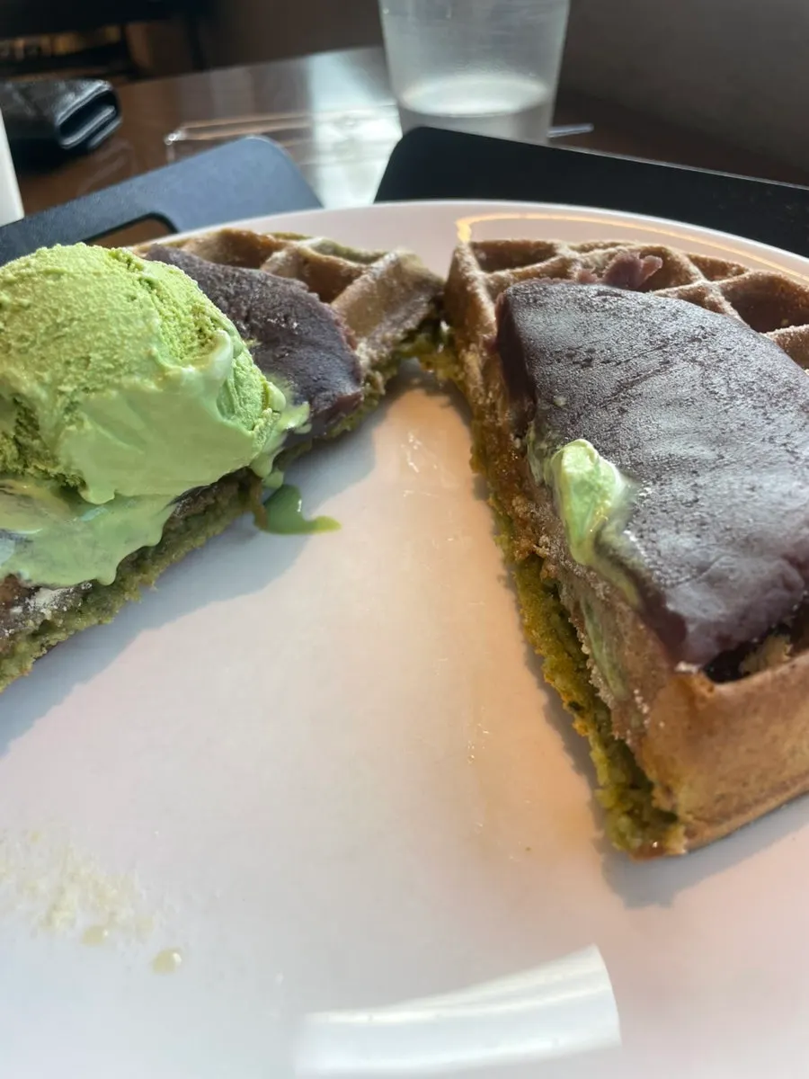 Warm matcha red bean waffle cut in half