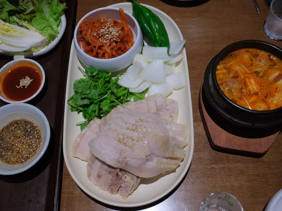Full table setting with all side dishes at Uldong Bossam