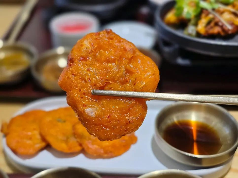 Four bite-sized pieces of crispy kimchi jeon