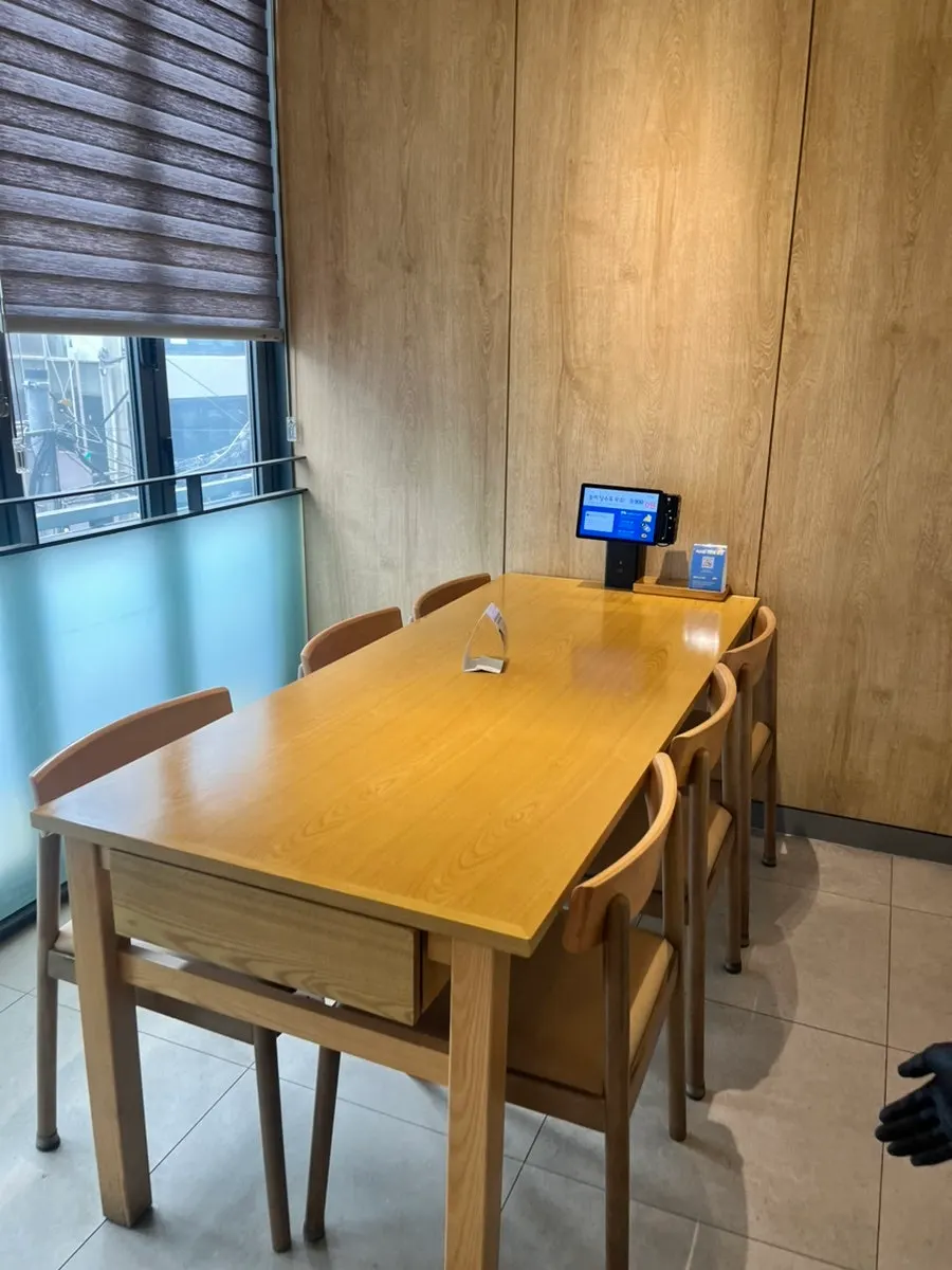 Interior of Cafe Dongi Main Branch in white and wood tones