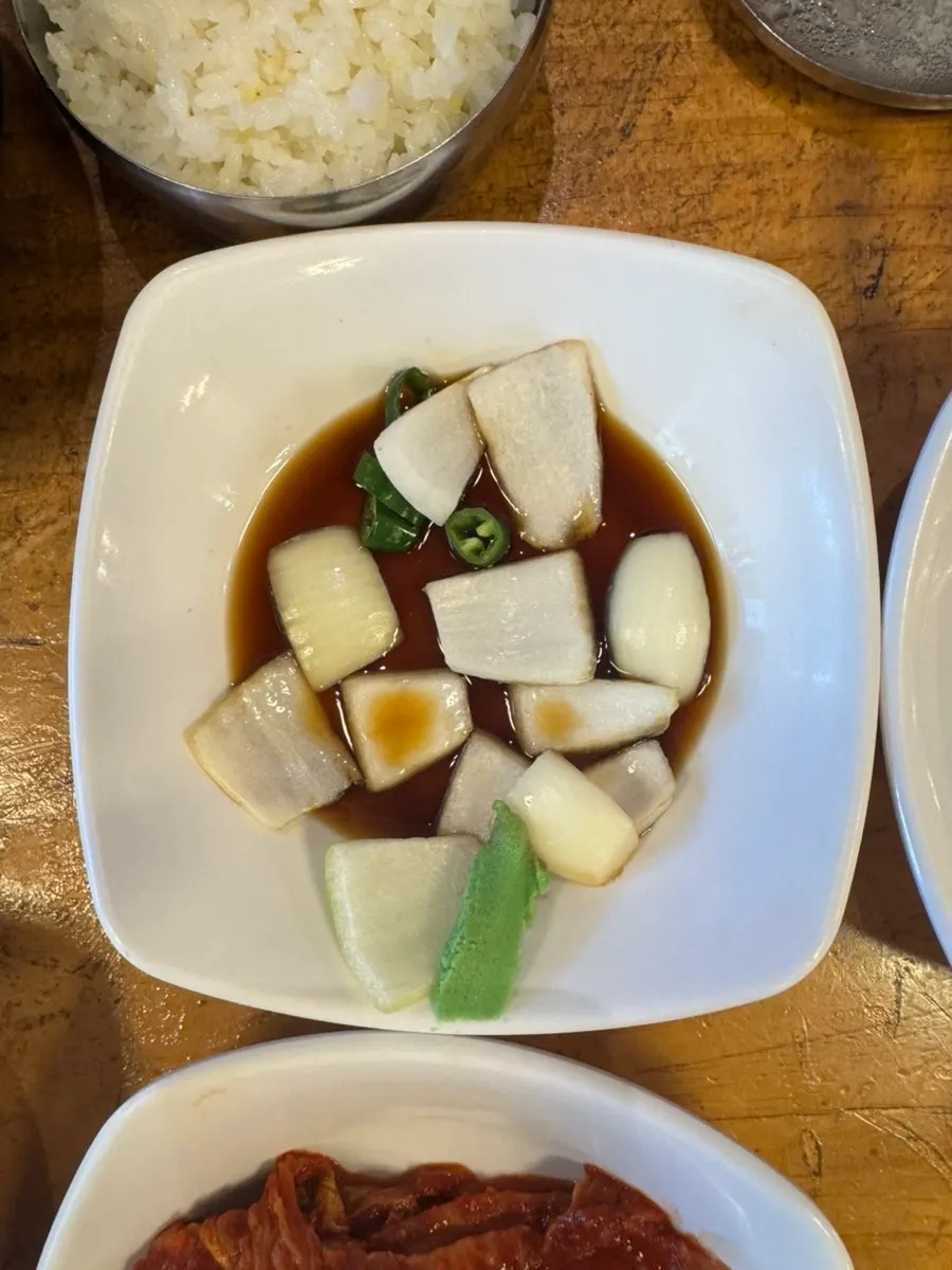 A spoonful of the rich broth