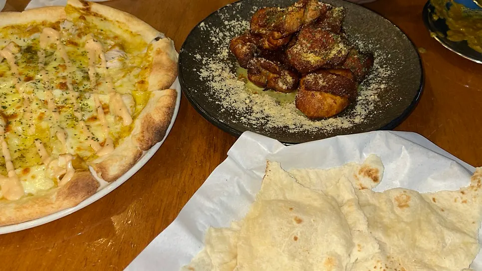 Chicken drizzled with traditional Indian and mustard sauces