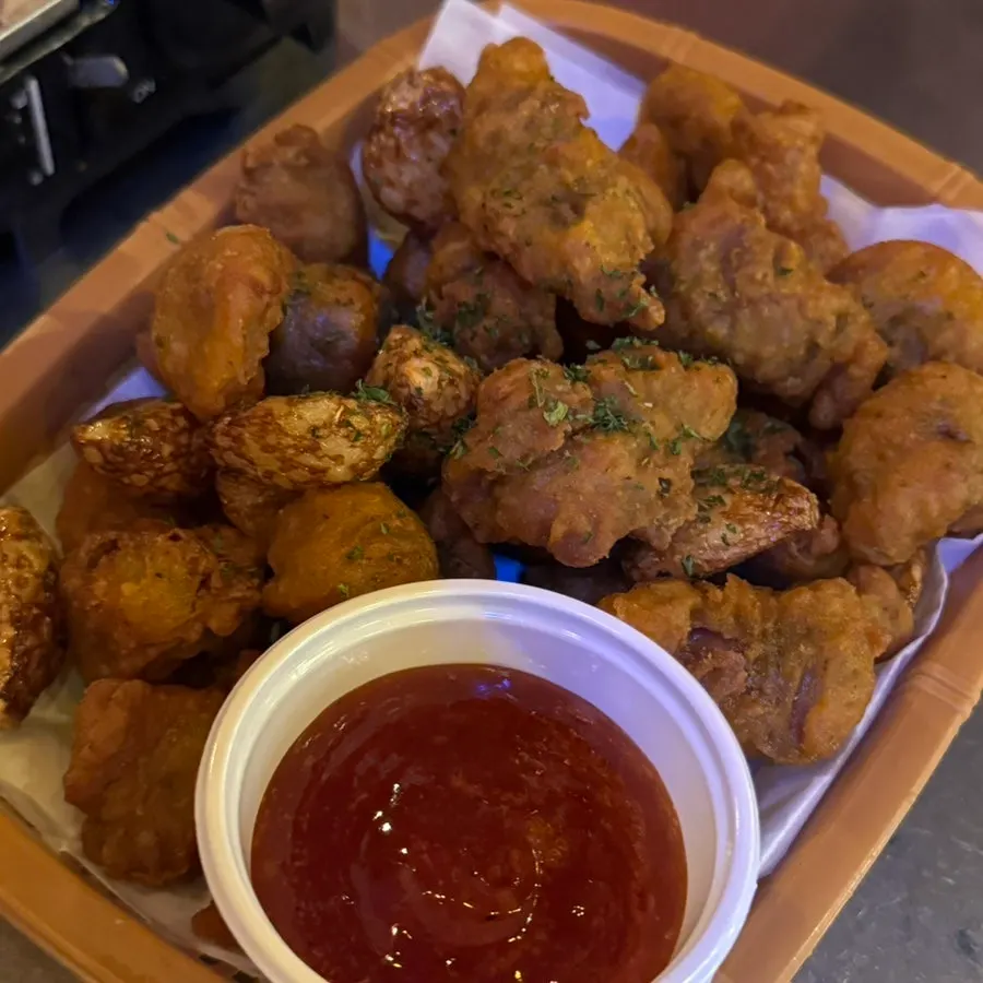 Fried chicken gizzards with whole garlic