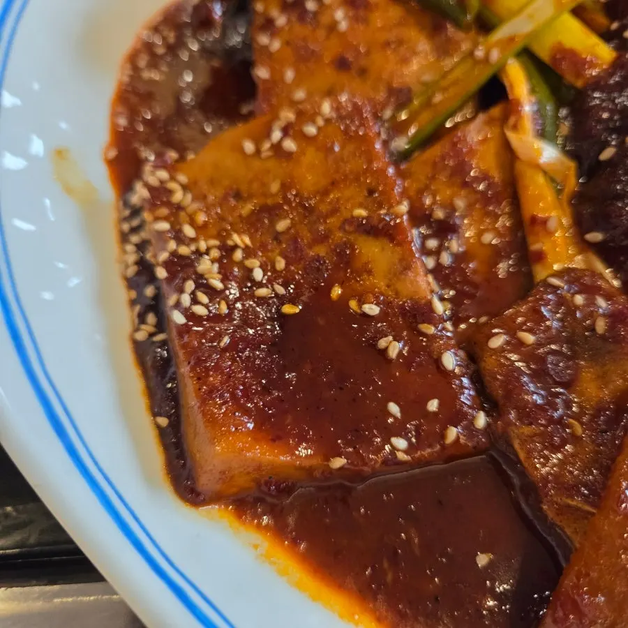 Tofu soaked in sauce inside the steamed Daegu cod head