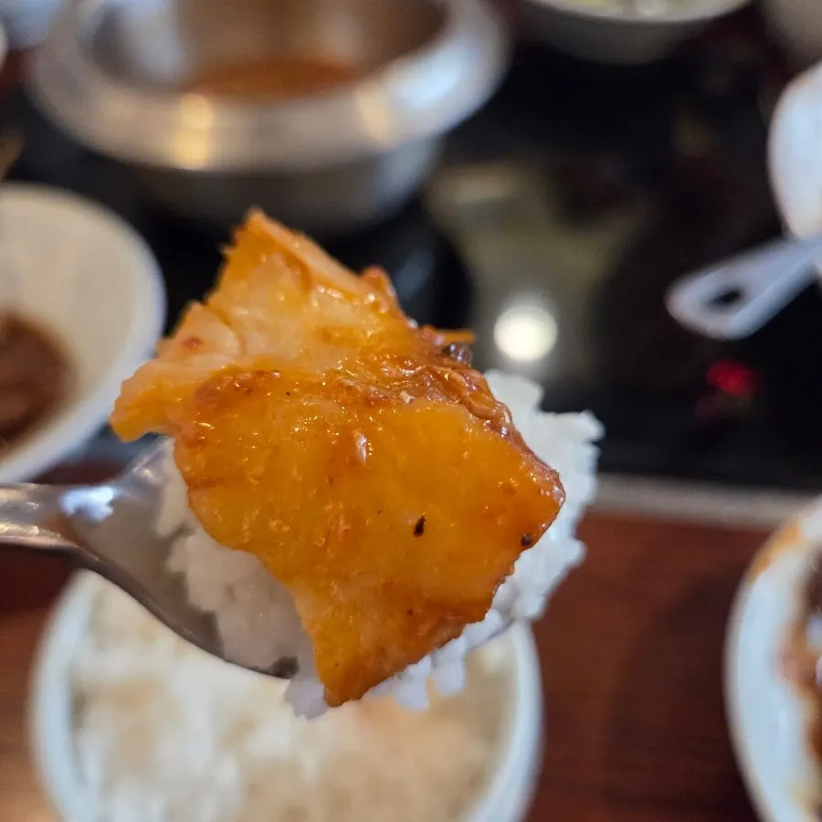 Radish and potato inside the braised cod dish
