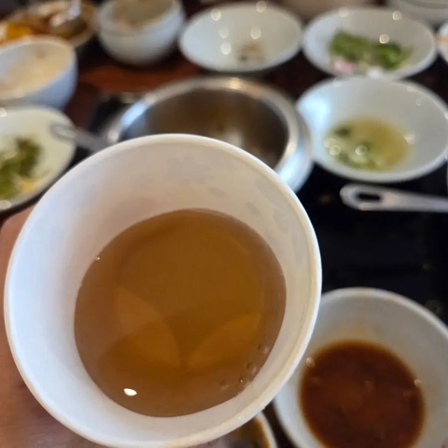 Bottle and cup of hutgae tea served at Pyeongsang Myeonok