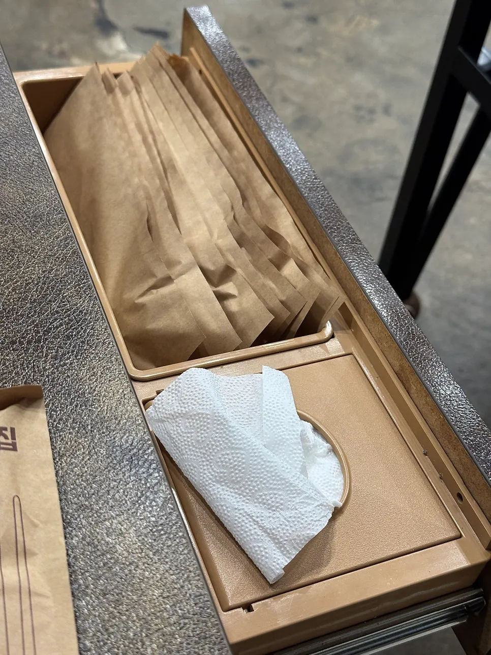 Utensils and tissues in the table drawer