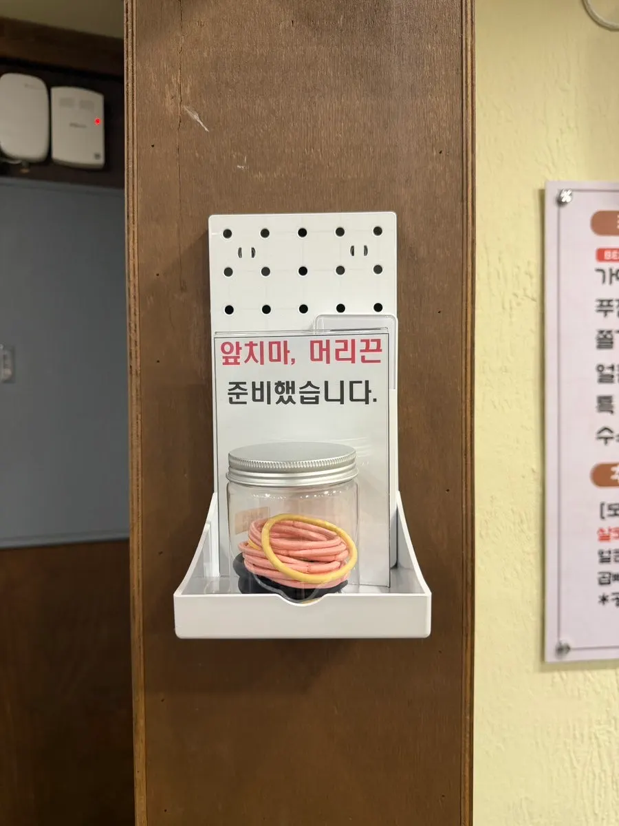 Apron and hair tie provided at the restaurant