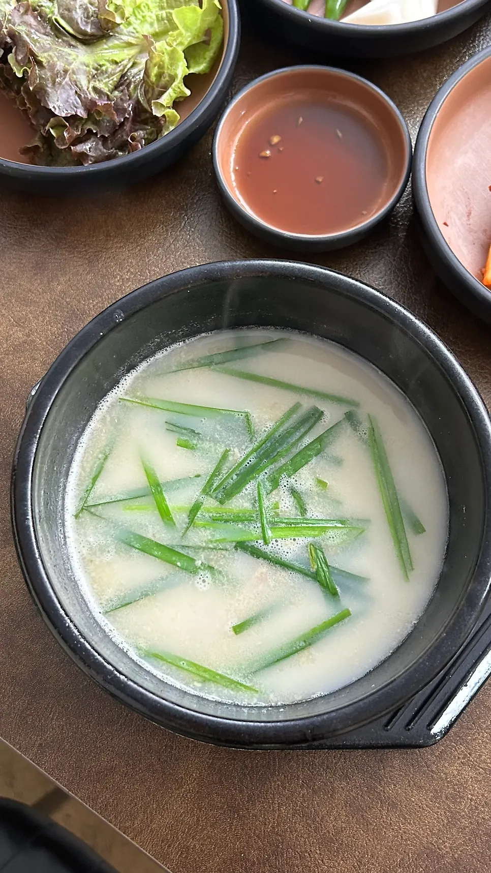 A spoonful of the spicy gukbap broth