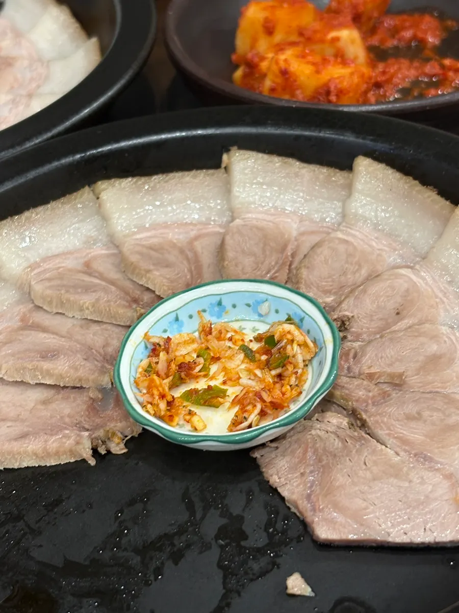 Suyuk fanned out on a plate with salted shrimp