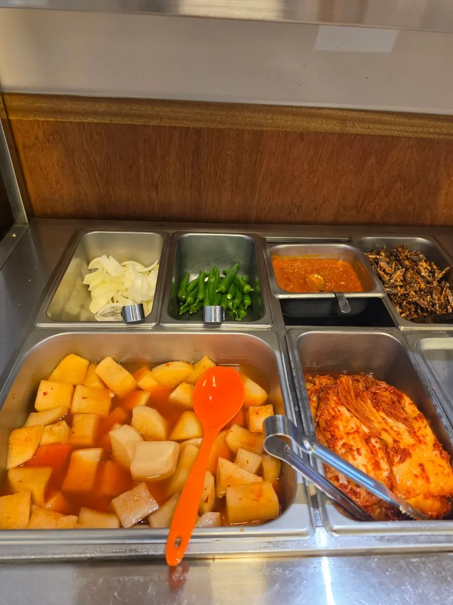 A warm table of Korean soup at Hanwoojang