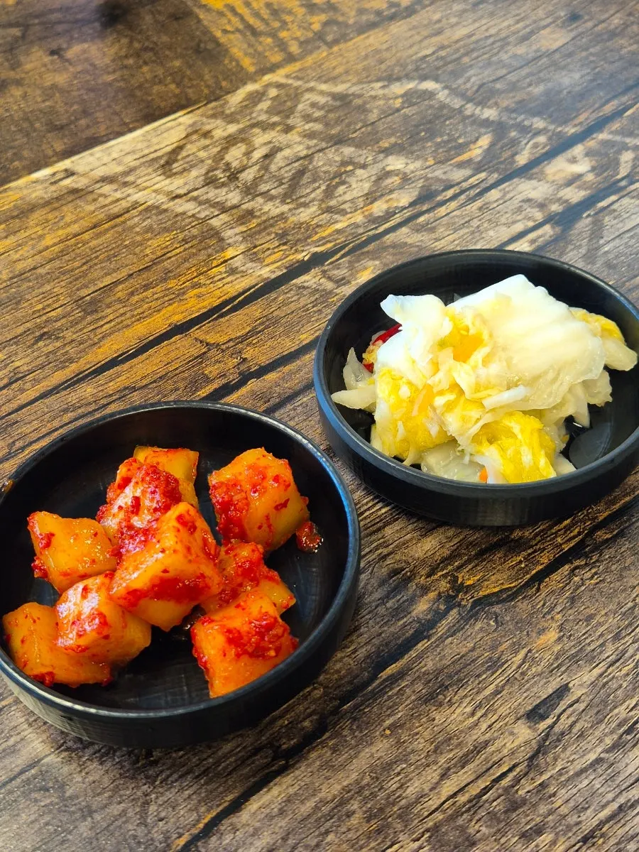 Kkakdugi and white kimchi side dishes