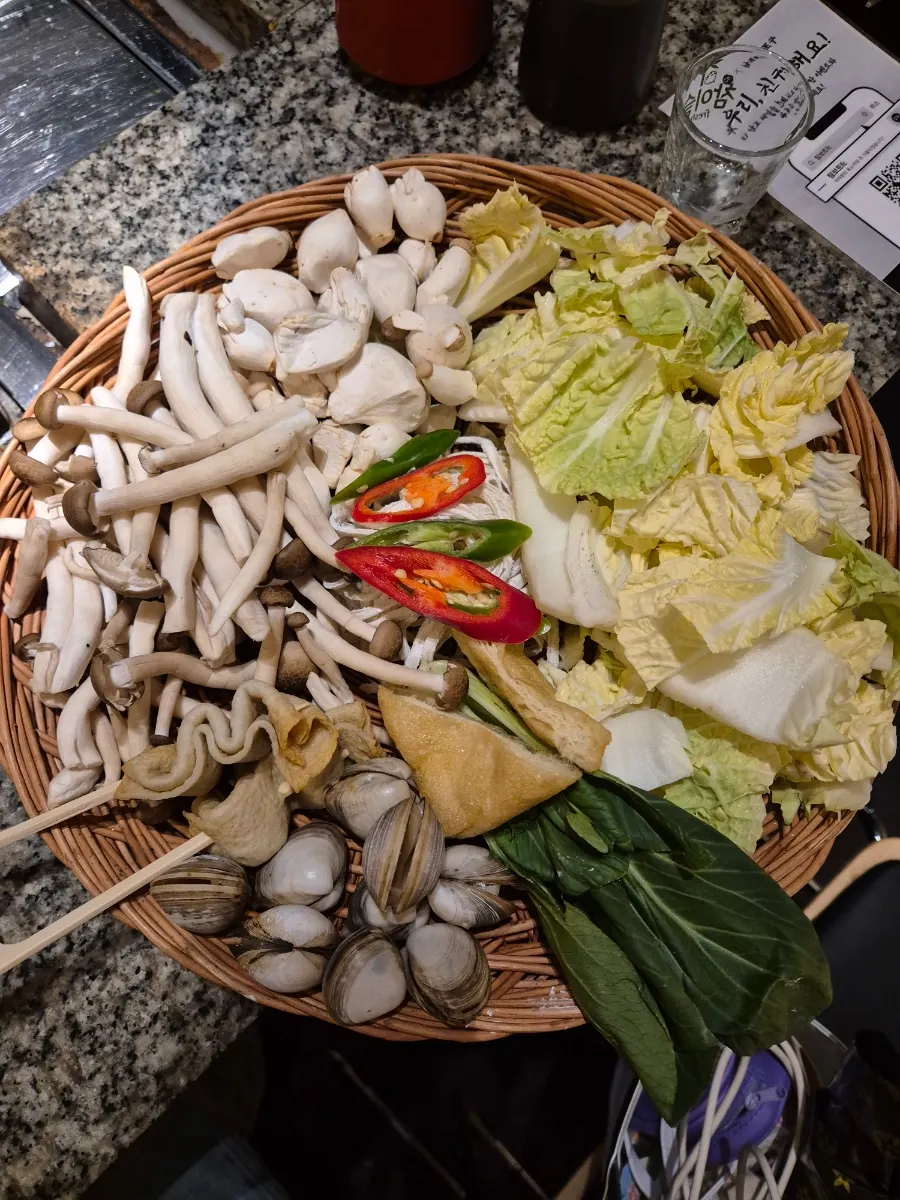 Knife-cut noodles included as a side with grilled shellfish orders