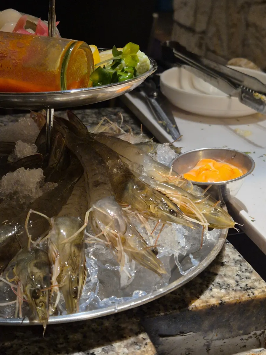 A plate of raw shrimp sashimi made with same-day delivered shrimp