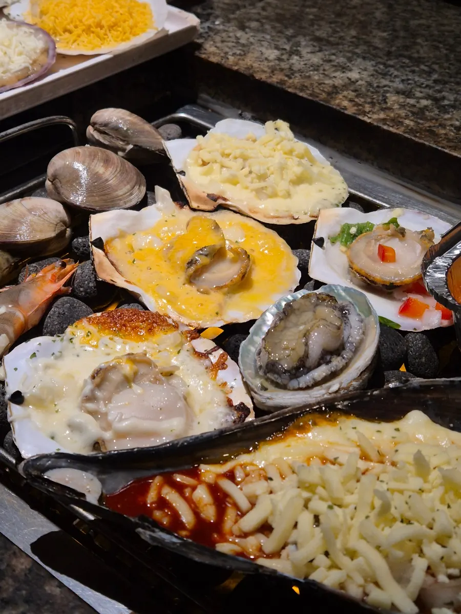 Well-cooked grilled shellfish enjoyed as a drinking snack