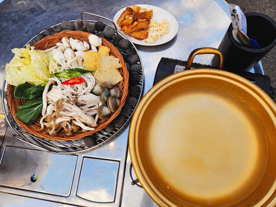 Complimentary shabu-shabu shellfish noodle soup served at the table