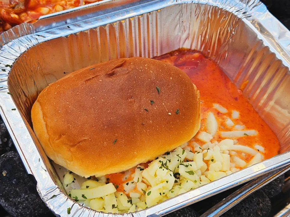 Fan mussel served with cheese and sauce