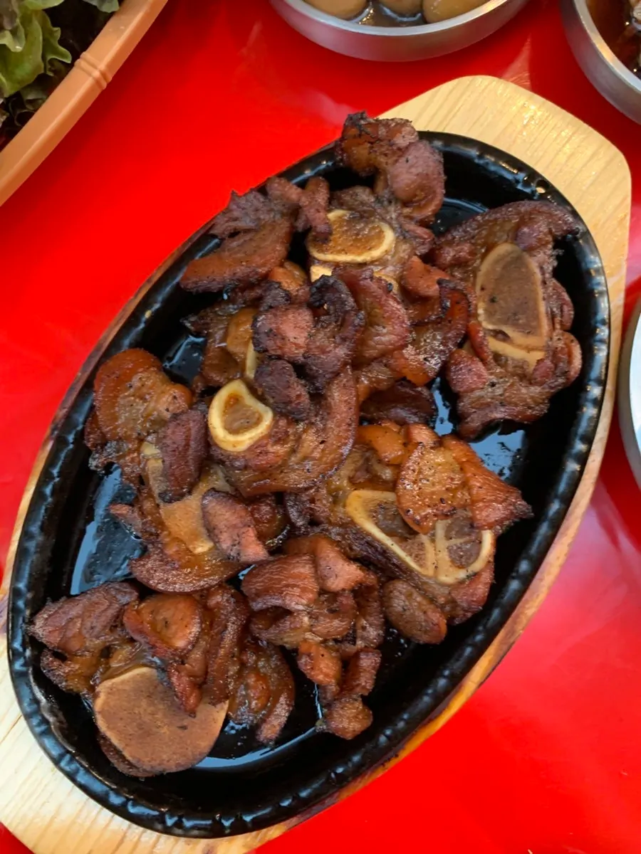 Black pork served with bean sprouts
