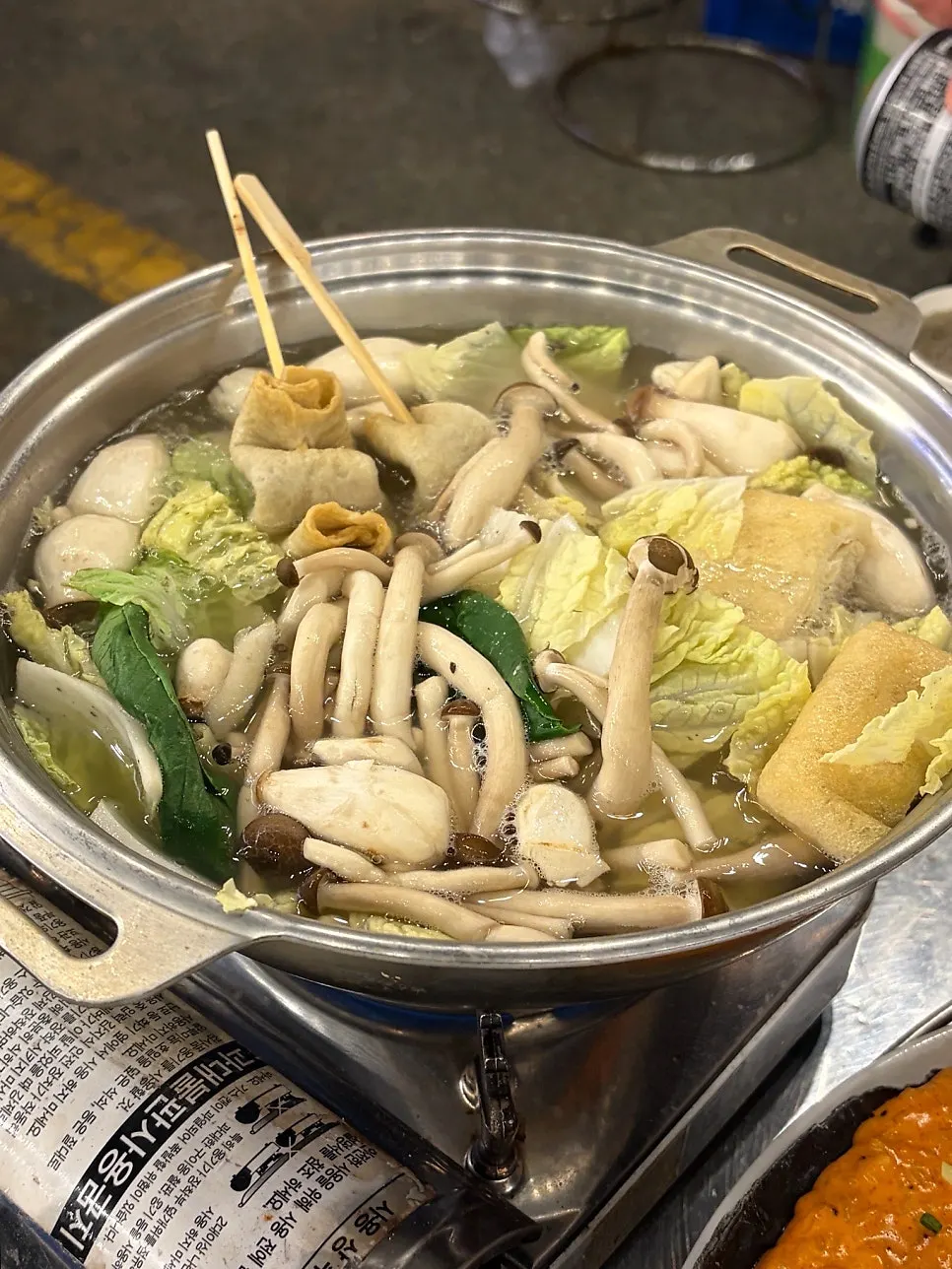 Close-up of the complimentary starter hot pot simmering