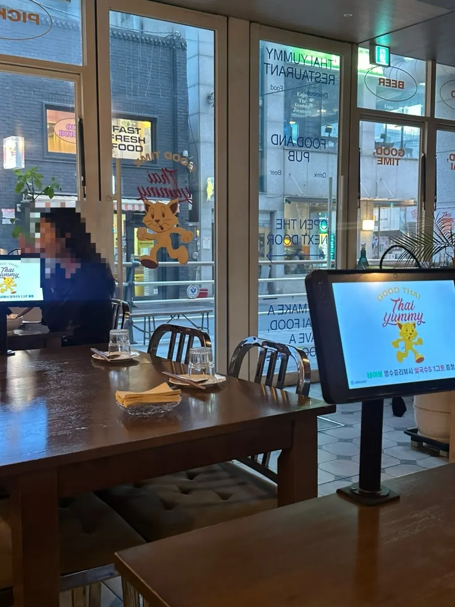 Bar table and 2-person seating at Thai Yami