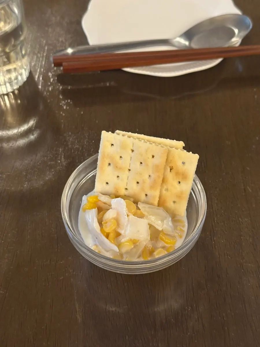Complimentary crackers and corn salad