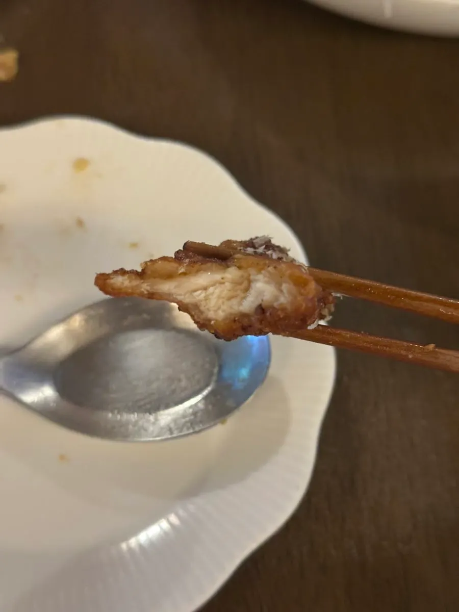 Cross-section of the boneless fried chicken with salad